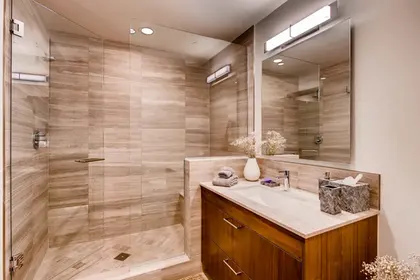The Lion Vail residence bathroom with glass shower via Expedia