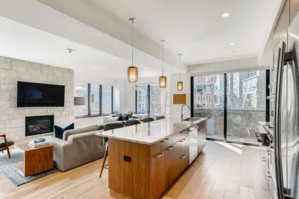 The Lion Vail open-plan residence with kitchen island via Expedia