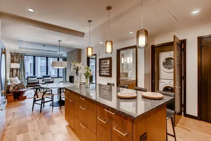 The Lion Vail residence kitchen with pendant lights via Expedia