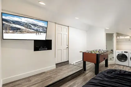 Enzian Vail condo rec room with foosball and laundry via Expedia