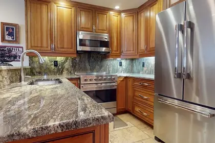 Enzian Vail condo kitchen with granite counters via Expedia