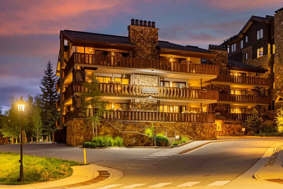 Enzian Vail condominium building at dusk via Expedia